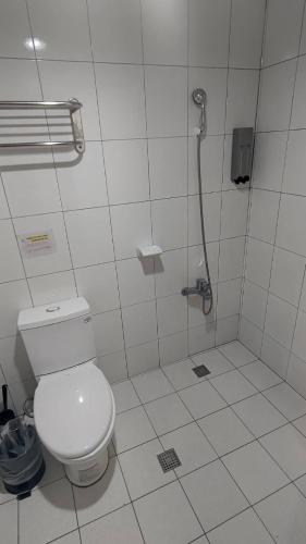 a bathroom with a shower with a toilet in it at Sleep Taipei Hotel - Nanya in Taipei