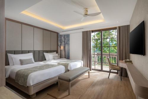 Postel nebo postele na pokoji v ubytování Tana Spring Resort Mae Chan