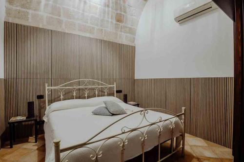 a bedroom with a white bed in a room at Cuore 46&48 by Travel with Gianni in Monopoli