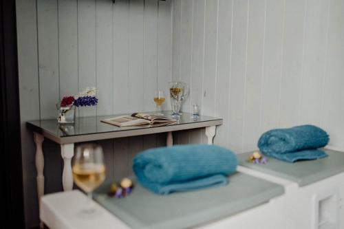 a table with two blue pillows and a glass at Cuore 46&48 by Travel with Gianni in Monopoli