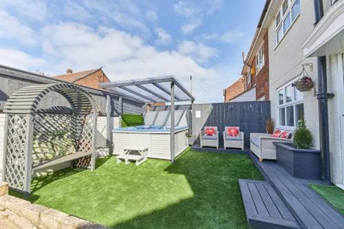 a backyard with a gazebo and a pool at Host & Stay - Stonehaven in Seaton Carew
