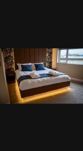 Postel nebo postele na pokoji v ubytování Clonmany Apartments