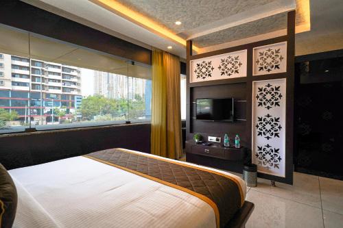 Katil atau katil-katil dalam bilik di Open Hotel by Olive - JK Residency