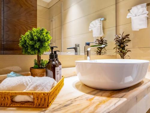 a bathroom sink with a large white bowl on a counter at New 1 BR Premium in Dubai