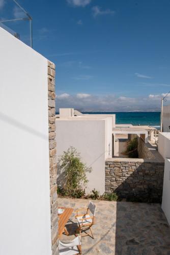 a view of the ocean from the balcony of a house at Deluxe Maisonette With Private Jacuzzi in Glifades