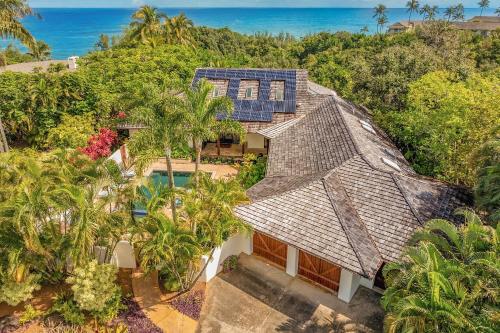 an overhead view of a house with solar panels on its roof at Kapiolani Villa home in Princeville