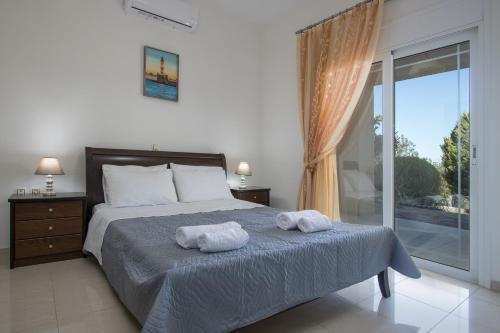 Ένα ή περισσότερα κρεβάτια σε δωμάτιο στο Villa Natura