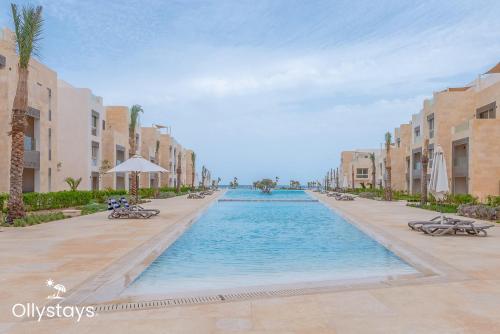 Πισίνα στο ή κοντά στο Ollystays Mangroovy Seaview 2BR Beach and Pool Free access