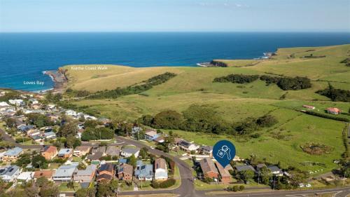 an aerial view of a suburb with the ocean at Heights Hideaway in Kiama