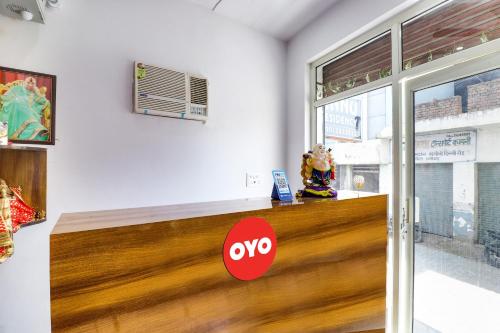 a sign that says oxy on a counter in a room at Hotel O ANNU RESIDENCY in Alīgarh