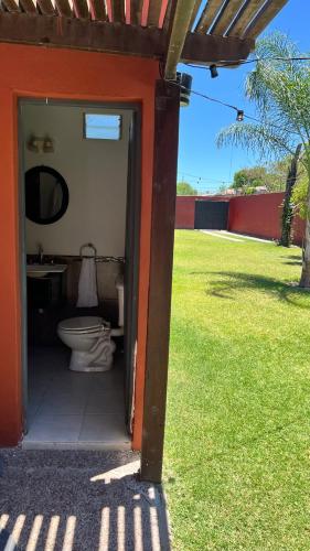 a bathroom with a toilet inside of a house at Casa de categoría para 6 personas in Santiago del Estero