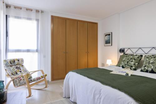 En eller flere senge i et værelse på Dorm4You Patacona