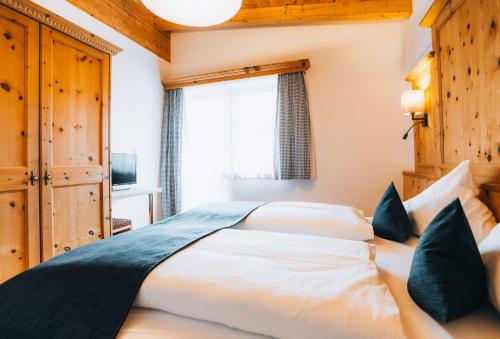 Postel nebo postele na pokoji v ubytování Grünwald Resort Sölden