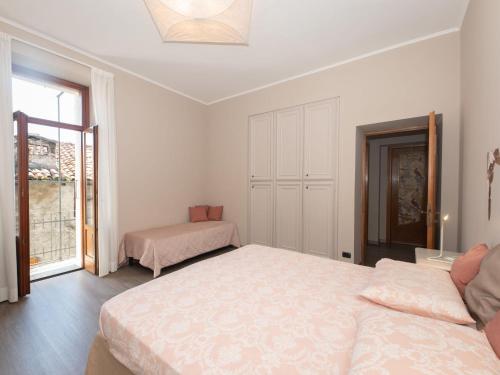 a bedroom with two beds and a window at Apartment Bac 1 by Interhome in Mergozzo