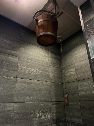 a basket hanging from the ceiling of a bathroom at Aparthotel Siente Boí & SPA in Pla de l'Ermita