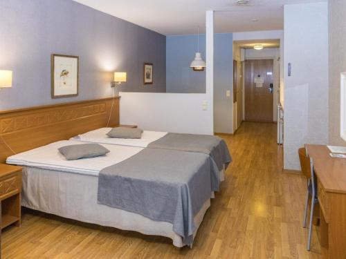 Postel nebo postele na pokoji v ubytování Holiday Home Hotelli terme- room 18 by Interhome