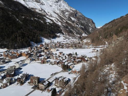 an aerial view of a small village in the snow at Apartment Haus Quelle-6 by Interhome in Saas-Grund