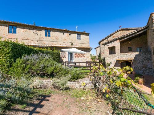 an old building with a gazebo in a yard at Apartment La Vigna by Interhome in Lucolena in Chianti