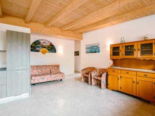 a living room with a couch and a table at Apartment Ciampedie by Interhome in Pera
