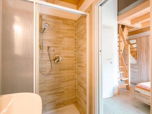 a bathroom with a shower and a toilet at Apartment Ciampedie by Interhome in Pera