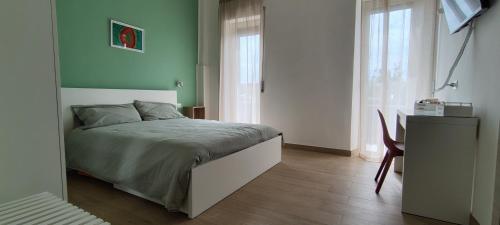 Ένα ή περισσότερα κρεβάτια σε δωμάτιο στο A Casa di Marco