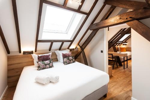 Postel nebo postele na pokoji v ubytování Hotel Onderbergen