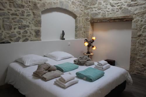 Llit o llits en una habitació de Le Sauvignon