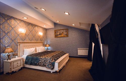 a bedroom with a large bed in a room at Baku Hotel Ganja in Ganja