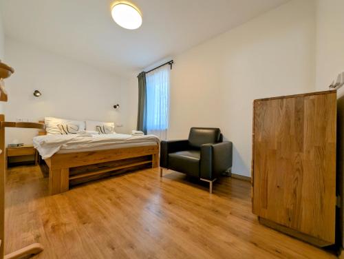 Postel nebo postele na pokoji v ubytování Rodinné apartmány Dobrné