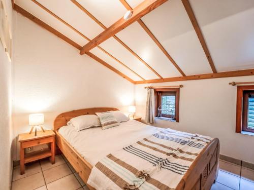 a bedroom with a bed in a room at Holiday Home Pippa with parking & garden by Interhome in De Haan