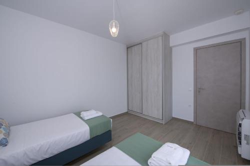 Ένα ή περισσότερα κρεβάτια σε δωμάτιο στο Almyrida Hills Villas