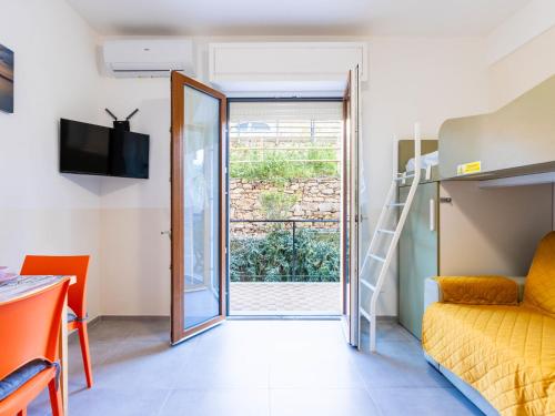 Ένα ή περισσότερα κρεβάτια σε δωμάτιο στο Apartment Il Piccolo Ulivo by Interhome