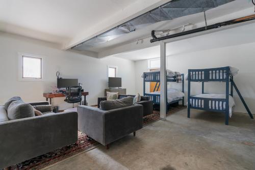 a living room with couches and a bunk bed at Secluded Mountain View Getaway - Near Jackson Hole - BBQ, Patio Wildlife! in Wilson