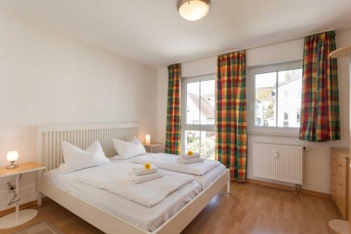 Postel nebo postele na pokoji v ubytování Appartementhaus Victoria - Whg B 18 - Meeresbrise