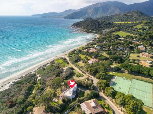 an aerial view of a beach with a red roof at Villa La Conchiglia by Interhome in Villasimius