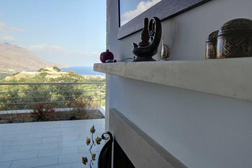 a balcony with a view of the ocean at Villa Simera, with pool & great view in Fournádhos
