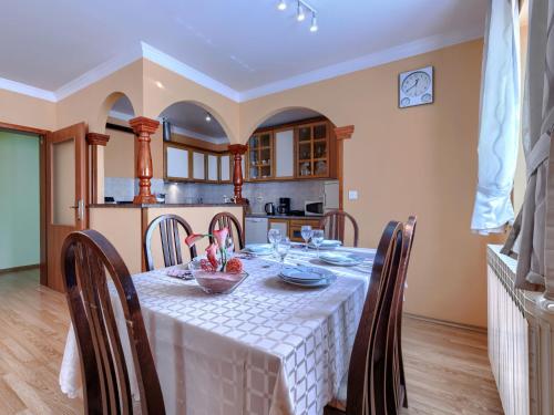 a dining room with a table and chairs and a kitchen at Holiday Home Soriso by Interhome in Motovun