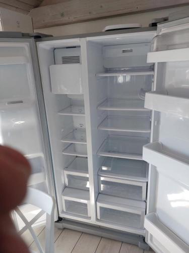 an empty refrigerator with its door open with its door open at Awesome Home In Särö With 1 Bedrooms And Wifi in Särö