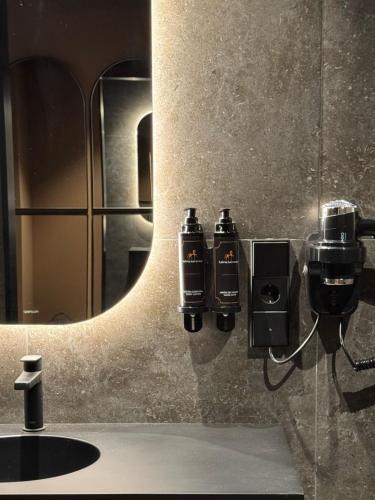 a bathroom with a sink and a mirror at Hotel Arena Select in Valencia