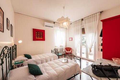 Ένα ή περισσότερα κρεβάτια σε δωμάτιο στο Casa Fuori Casa - 200 mt dal casello autostradale, parcheggio gratuito, garage moto