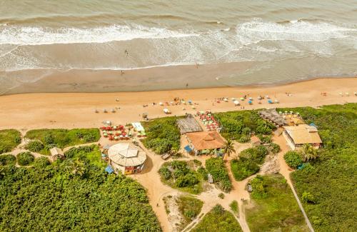 an overhead view of a beach with a group of people at Pousada dos Corais in Itaúnas