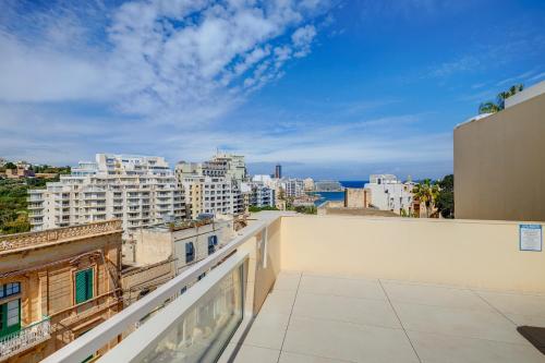 a balcony with a view of the city at Kirxa Rooms and Suites in Sliema