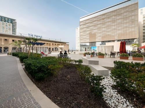 a courtyard in a city with a building at Kirxa Rooms and Suites in Sliema