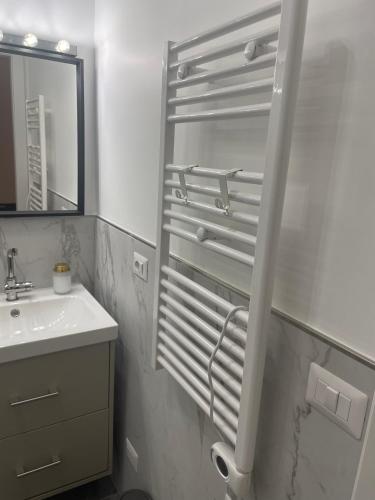 a white bathroom with a sink and a mirror at Little Milan - LM2 - LM3 - LM4 in Milan
