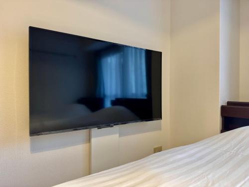TV in/ali zabaviščno središče v nastanitvi Monica ONE 302号室名古屋駅前