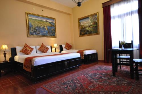 Postel nebo postele na pokoji v ubytování Boutique Hotel Palacio