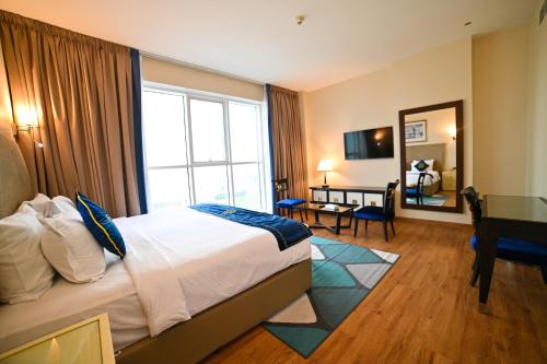 Un ou plusieurs lits dans un hébergement de l'établissement Seven Seas Hotel