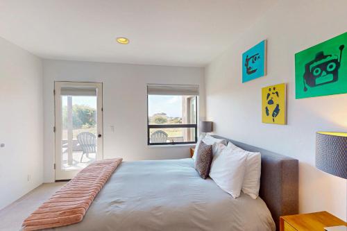 a bedroom with a large bed and a window at Blue Mermaid in Sea Ranch