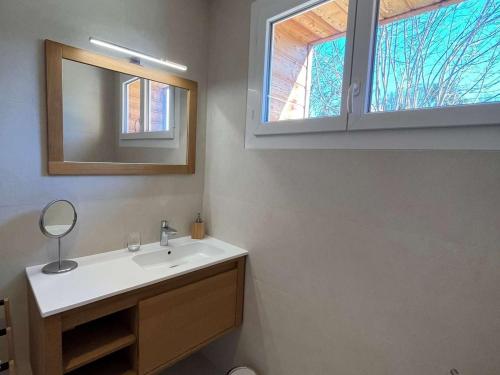 a bathroom with a sink and a mirror at Maison rénovée avec piscine privée, 3 chambres à Calès - FR-1-824-8 in Calès