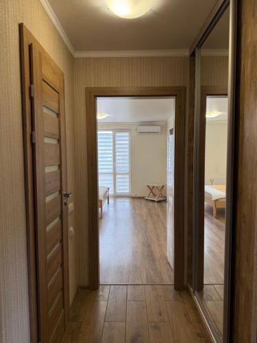 an open door to a room with a bedroom at Отель "София" in Vinnytsya